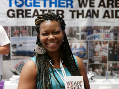 Smiling woman at Greater Than HIV at USCA 2016!
