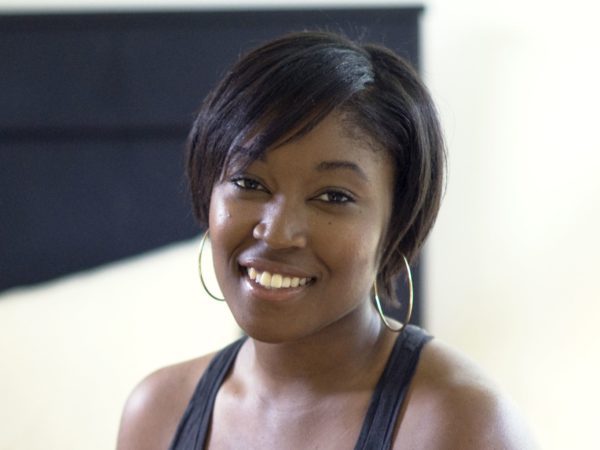 smiling woman with hoop earrings