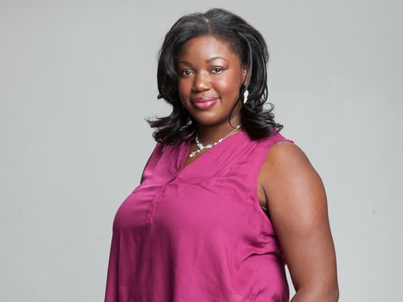 Black woman with pink shirt smiling