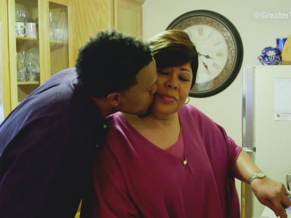 A man kissing his mom on the cheek