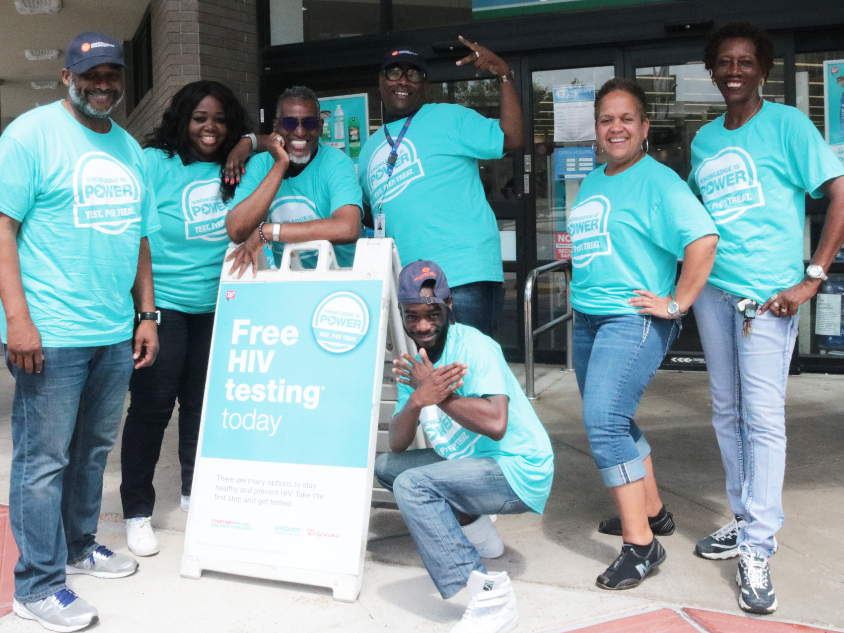 People standing with Free HIV testing sign