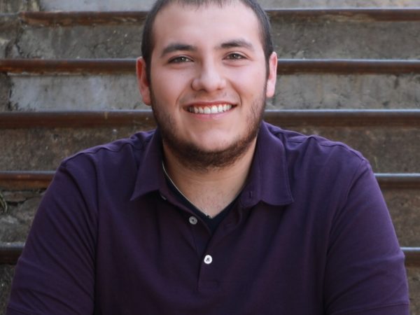 Man sitting on stairs smiling